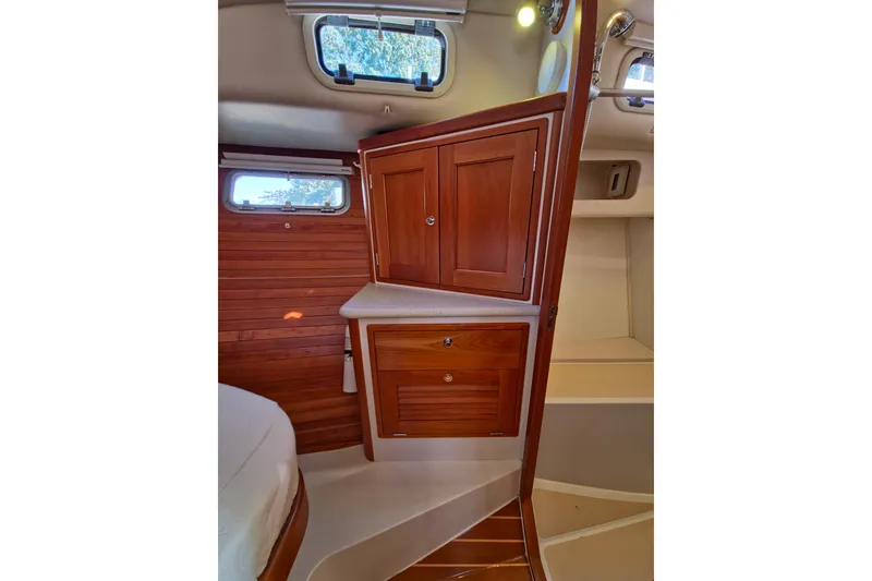 Slide: The Image of 2011 MJM 40z Downeast yacht interior with wooden cabinetry and porthole window. - 35
