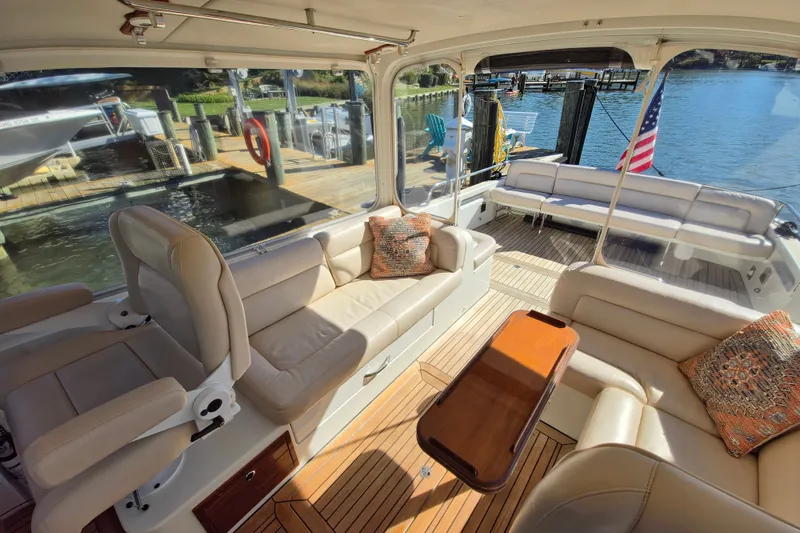 Slide: The Image of Luxurious interior of 2011 MJM 40z Downeast yacht with plush seating and wooden accents. - 19