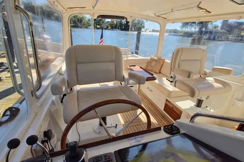 Slide: The Image of Interior of 2011 MJM 40z Downeast boat with helm and seating area. - 16