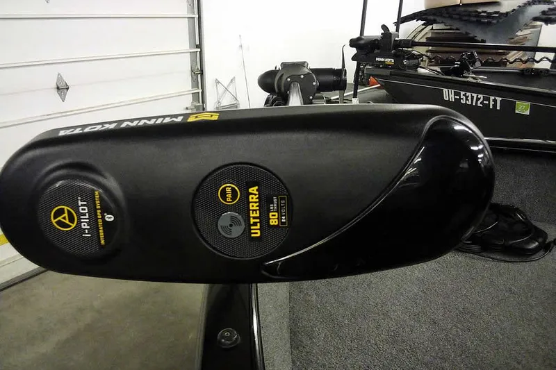 Slide: The Image of Minn Kota Ulterra motor on 2022 Tracker Pro Guide V-16 WT boat in garage. - 14