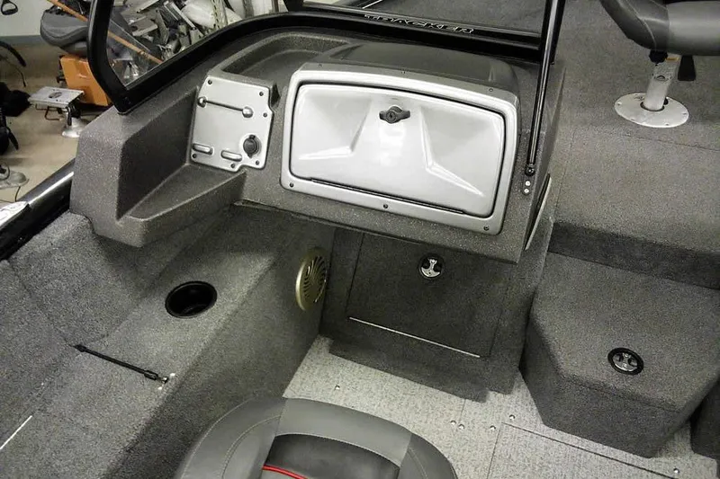 Slide: The Image of 2022 Tracker Pro Guide V-16 WT boat interior with storage compartments and seating. - 17