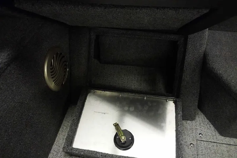 Slide: The Image of Interior of 2022 Tracker Pro Guide V-16 WT boat, featuring speaker and storage compartment. - 20