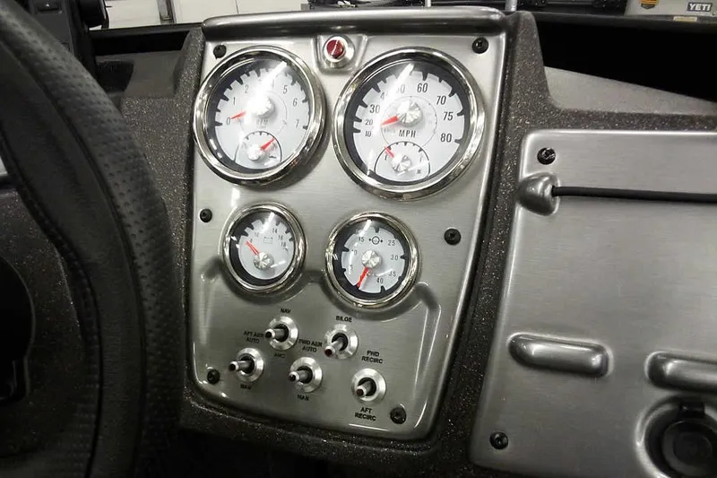 Slide: The Image of 2022 Tracker Pro Guide V-16 WT dashboard with gauges and controls. - 23
