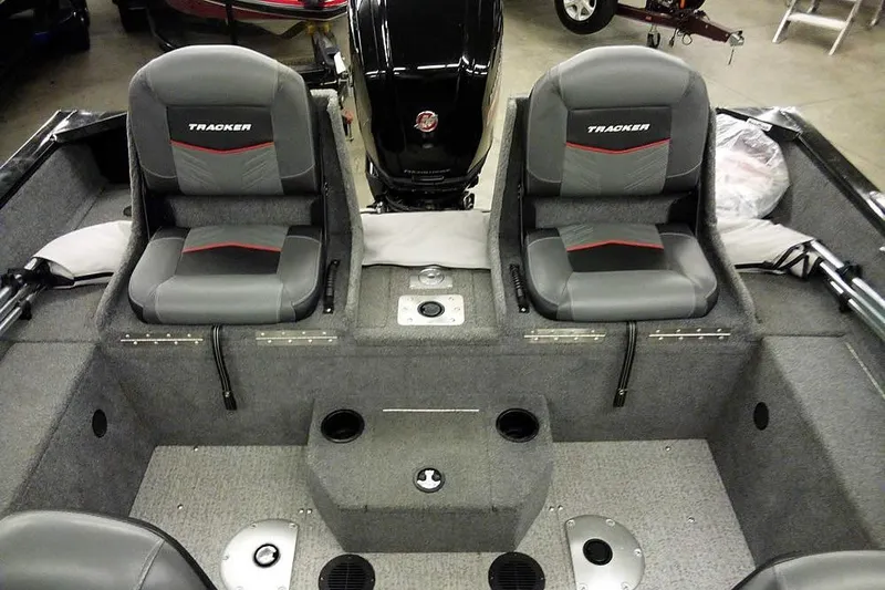 Slide: The Image of 2022 Tracker Pro Guide V-16 WT boat interior with dual seats and motor. - 26