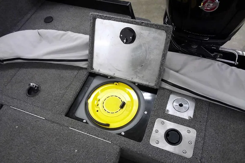 Slide: The Image of 2022 Tracker Pro Guide V-16 WT boat interior with storage compartment and engine view. - 29