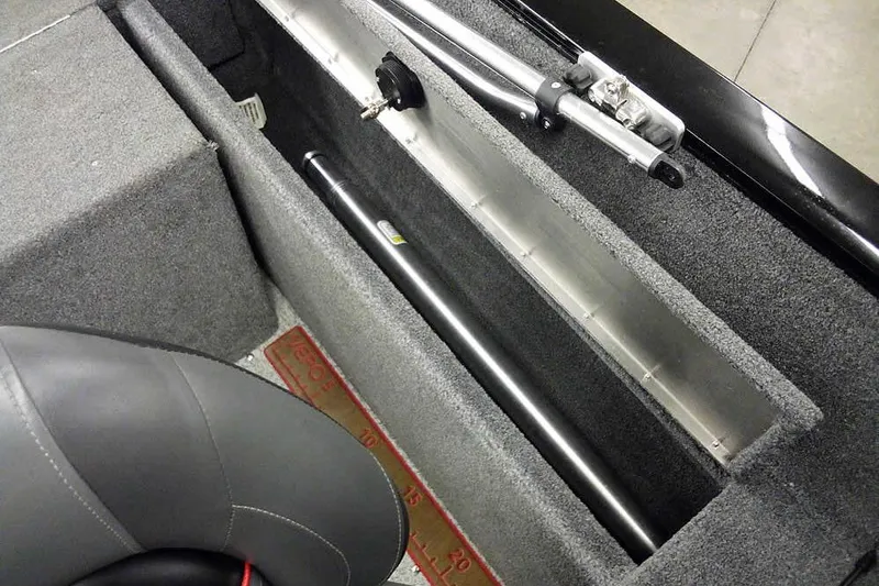 Slide: The Image of 2022 Tracker Pro Guide V-16 WT boat interior with rod storage compartment. - 31