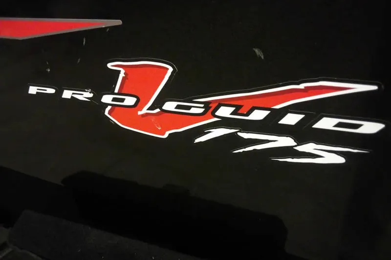 Slide: The Image of Tracker Pro Guide V-16 WT 2022 model logo with bold red and white lettering. - 5