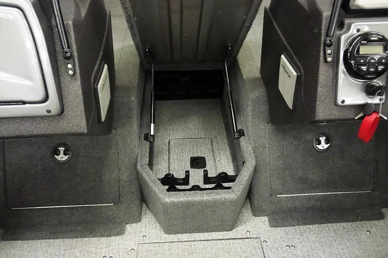 Slide: The Image of 2022 Tracker Pro Guide V-16 WT interior storage compartment with control panel and key. - 9