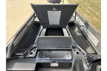 Slide: The Image of 2017 Nitro Z20 Pro boat storage compartments open, showcasing interior space. - 6