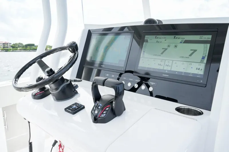 Slide: The Image of Luxurious seating on 2026 Jupiter 30 boat with elegant design and wood accents. - 13