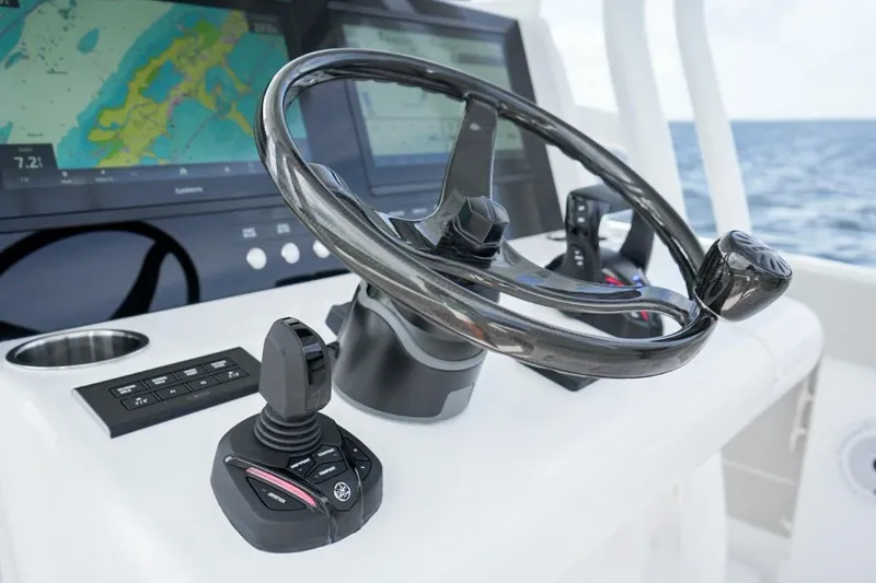 Slide: The Image of Luxurious white seating on 2026 Jupiter 30 boat under clear blue sky. - 15