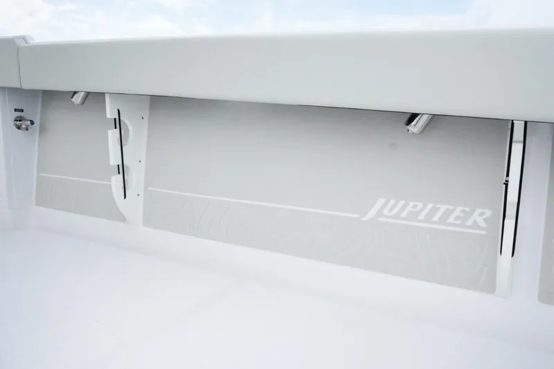 Slide: The Image of Luxury helm seating on 2026 Jupiter 30 boat with advanced navigation displays. - 17