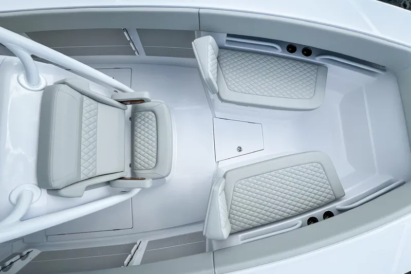 Slide: The Image of 2026 Jupiter 30 boat interior with white grab rails and speaker. - 18