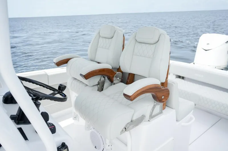 Slide: The Image of 2026 Jupiter 30 boat interior with luxurious white seating and modern dashboard. - 20