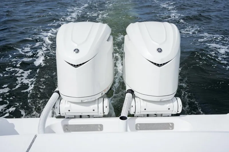 Slide: The Image of 2026 Jupiter 30 boat dashboard with dual screens and steering wheel. - 21