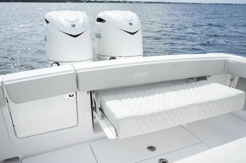 Slide: The Image of Luxury seating and dual engines on a 2026 Jupiter 30 boat, cruising on open water. - 33