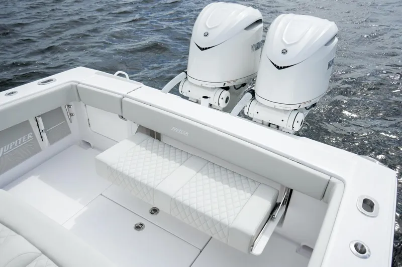 Slide: The Image of 2026 Jupiter 30 boat with dual outboard engines on water. - 34