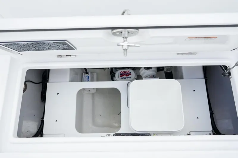 Slide: The Image of 2026 Jupiter 30 boat on trailer outside dealership under clear sky. - 8