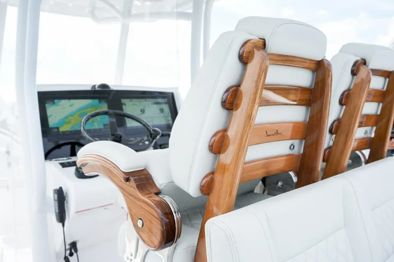 Slide: The Image of 2026 Jupiter 30 boat on trailer, parked outdoors under clear sky. - 9