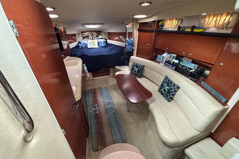 Slide: The Image of Interior of 2005 Sea Ray 340 Sundancer yacht with cozy seating and elegant wood finishes. - 22