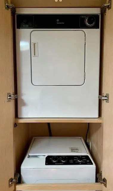 Slide: The Image of Laundry appliances in a 1999 Carver 456 Aft Cabin Motor Yacht cabinet. - 29