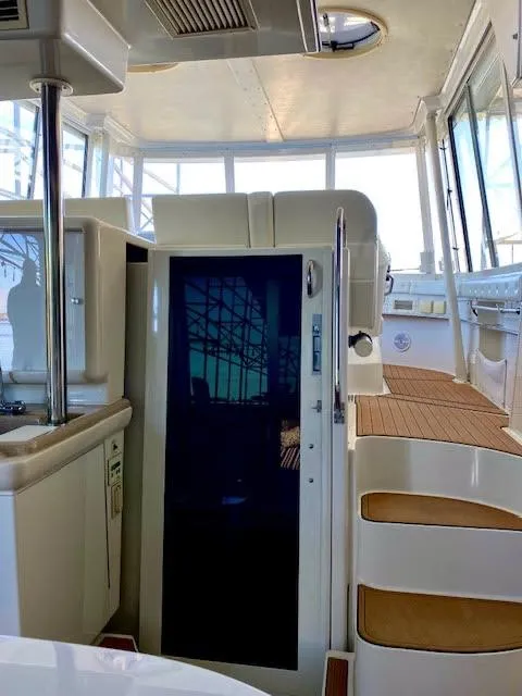 Slide: The Image of 1999 Carver 456 Aft Cabin Motor Yacht interior with modern design and wooden accents. - 9
