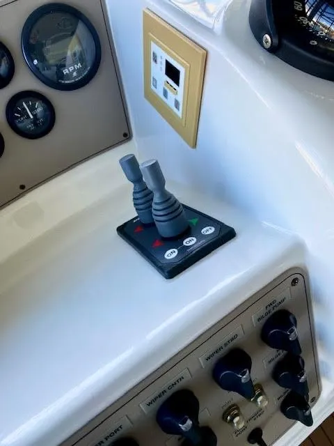 Slide: The Image of Control panel of 1999 Carver 456 Aft Cabin Motor Yacht with joysticks and gauges. - 14