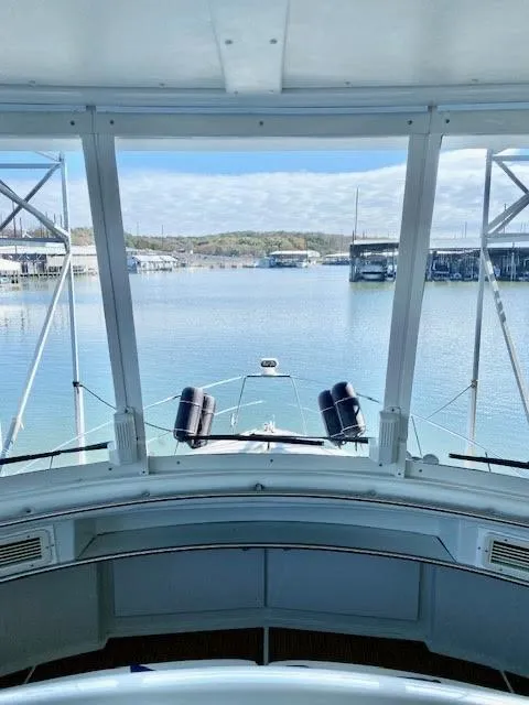 Slide: The Image of 1999 Carver 456 Aft Cabin Motor Yacht view from helm, overlooking marina. - 15