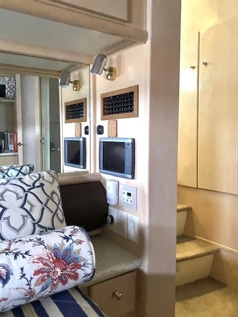 Slide: The Image of Interior of 1999 Carver 456 Aft Cabin Motor Yacht with cozy seating and modern amenities. - 34