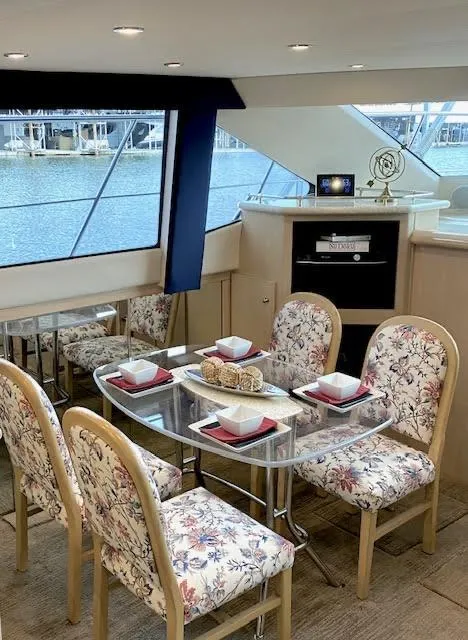 Slide: The Image of Interior of 1999 Carver 456 Aft Cabin Motor Yacht with elegant dining area. - 39