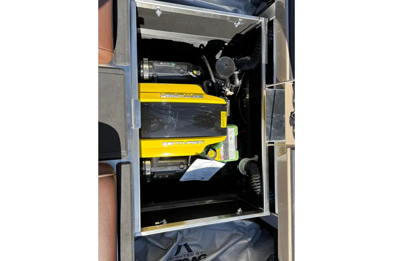 Slide: The Image of 2026 Centurion Ri265 engine compartment with yellow cover and visible components. - 14
