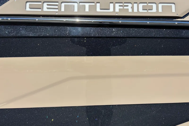 Slide: The Image of 2026 Centurion Ri265 boat with metallic finish and logo detail. - 15