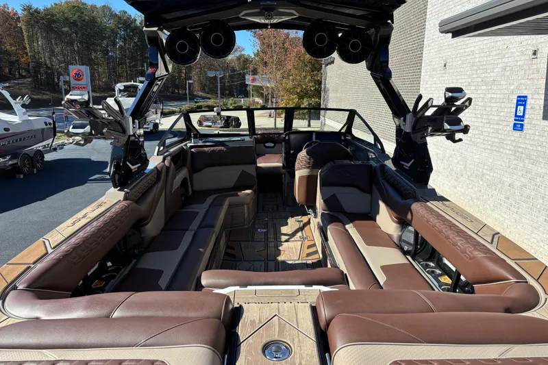 Slide: The Image of Luxurious interior of 2026 Centurion Ri265 boat with brown leather seating. - 6