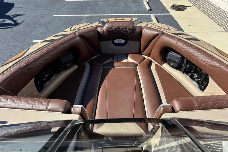 Slide: The Image of Luxurious interior of 2026 Centurion Ri265 boat with brown leather seating. - 7