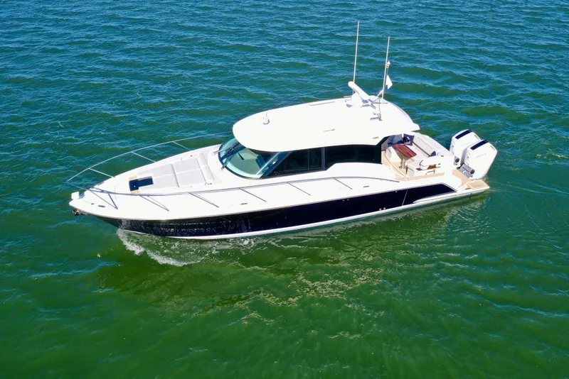 The Image of 2025 Tiara Yachts 43 LE cruising on open water, showcasing sleek design and luxury features. - 0