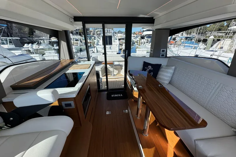Slide: The Image of Interior of 2025 Tiara Yachts 43 LE, featuring elegant seating and modern amenities. - 30