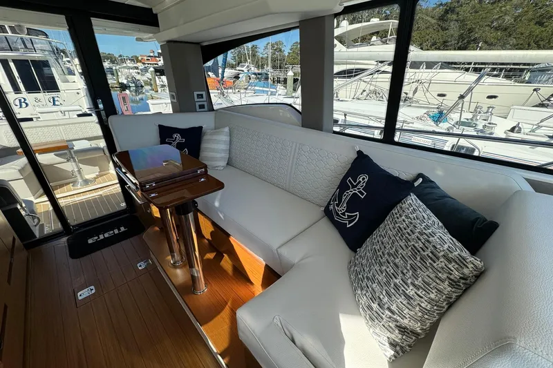 Slide: The Image of Luxurious interior of 2025 Tiara Yachts 43 LE with elegant seating and nautical decor. - 31