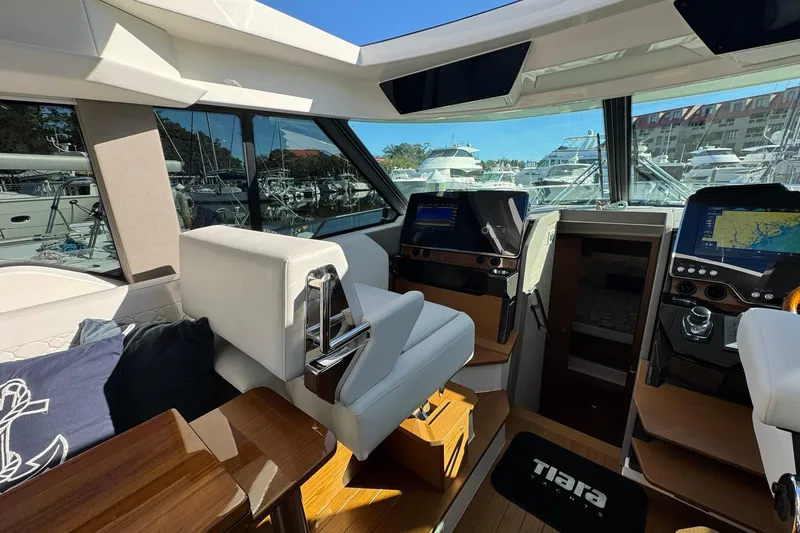 Slide: The Image of Interior of 2025 Tiara Yachts 43 LE, featuring modern navigation displays and luxurious seating. - 37