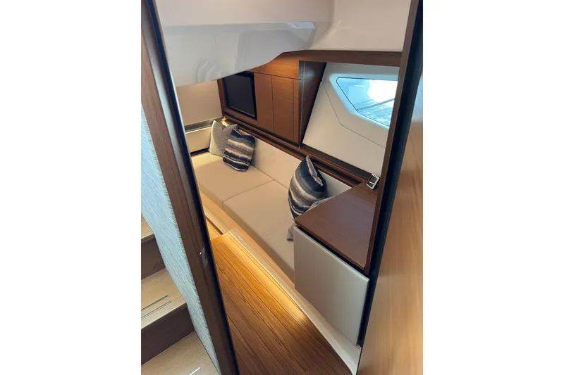 Slide: The Image of Luxurious interior of 2025 Tiara Yachts 43 LE, featuring elegant seating and modern design. - 49