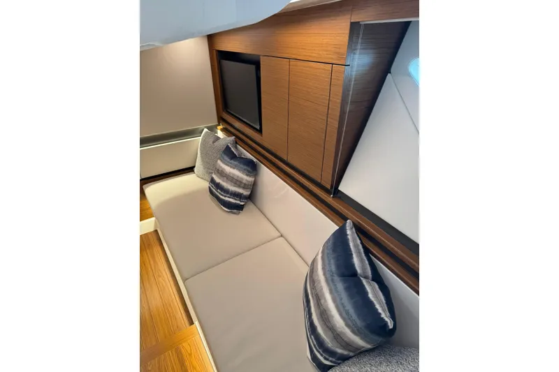Slide: The Image of Luxurious interior of 2025 Tiara Yachts 43 LE with modern seating and stylish cushions. - 50