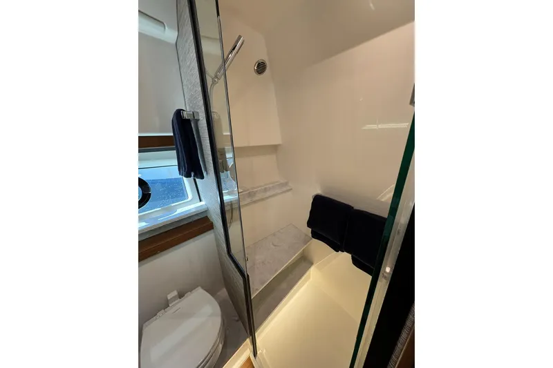 Slide: The Image of Luxurious bathroom in 2025 Tiara Yachts 43 LE, featuring modern shower and elegant design. - 54