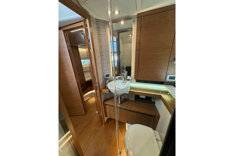 Slide: The Image of Luxurious bathroom interior of 2025 Tiara Yachts 43 LE, featuring modern wood finishes. - 56