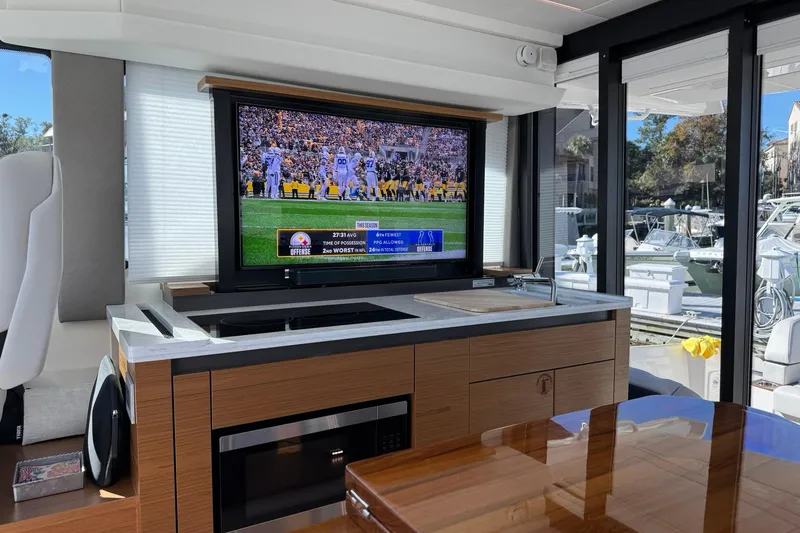 Slide: The Image of Interior of 2025 Tiara Yachts 43 LE with TV and kitchenette. - 57