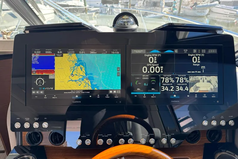 Slide: The Image of Dashboard of 2025 Tiara Yachts 43 LE with navigation and engine displays. - 60