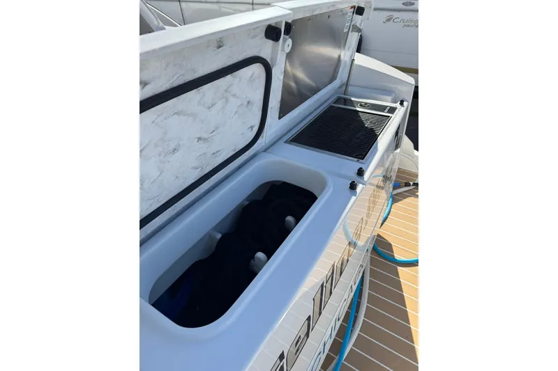 Slide: The Image of 2025 Tiara Yachts 43 LE deck storage and grill area, showcasing modern design. - 65