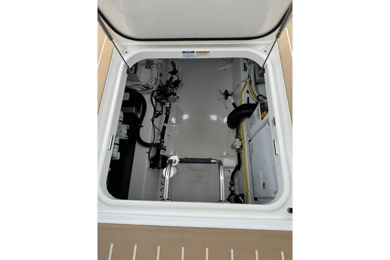 Slide: The Image of Engine compartment of 2025 Tiara Yachts 43 LE, showcasing clean and organized layout. - 66