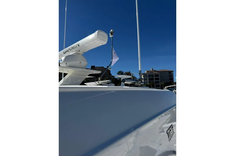 Slide: The Image of 2025 Tiara Yachts 43 LE with Garmin radar, docked under clear blue sky. - 75