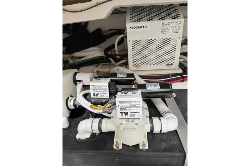 Slide: The Image of Engine compartment of 2025 Tiara Yachts 43 LE with Dometic equipment and wiring. - 81