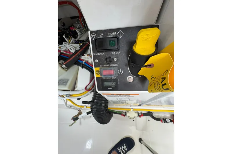 Slide: The Image of Control panel of 2025 Tiara Yachts 43 LE with emergency stop and circuit breaker. - 86