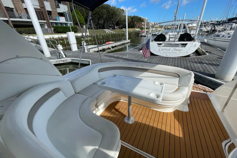 Slide: The Image of 2005 Sea Ray 340 Sundancer cockpit with plush seating and sleek dashboard design. - 14